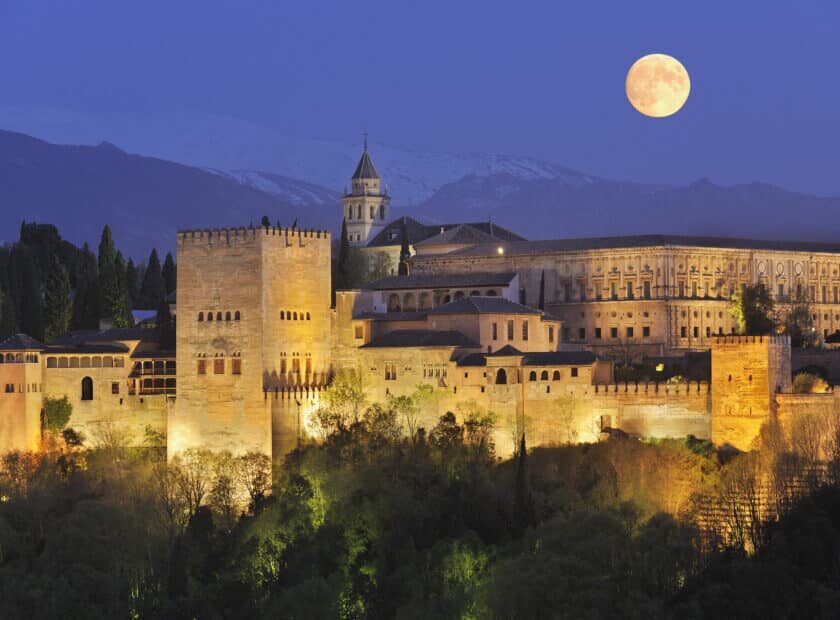 Spain, Andalusia, Granada Province, View of Alhambra Palace illuminated at night